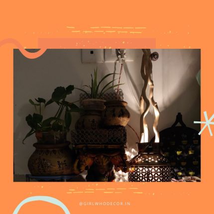 GirlWhoDecor Girlwho Says branded graphic with layered home lighting tips for Indian homes including warm bulbs brass diyas and terracotta holders
