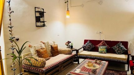 Cream walls, crystal chandelier and warm ambient light — quiet luxury home decor India by GirlWhoDecor
